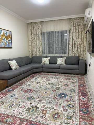 Teal and red medallion hand knotted Tabriz carpet