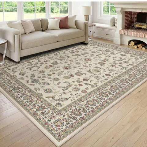 Round red geometric hand knotted carpet with fringe