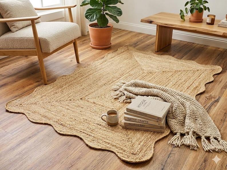 Natural jute rug with wavy organic edge and throw blanket