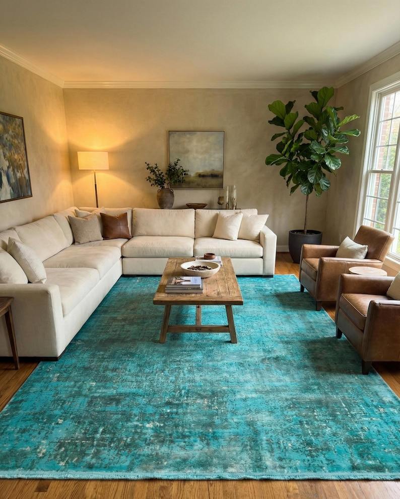 Turquoise overdyed vintage silk rug in warm living room